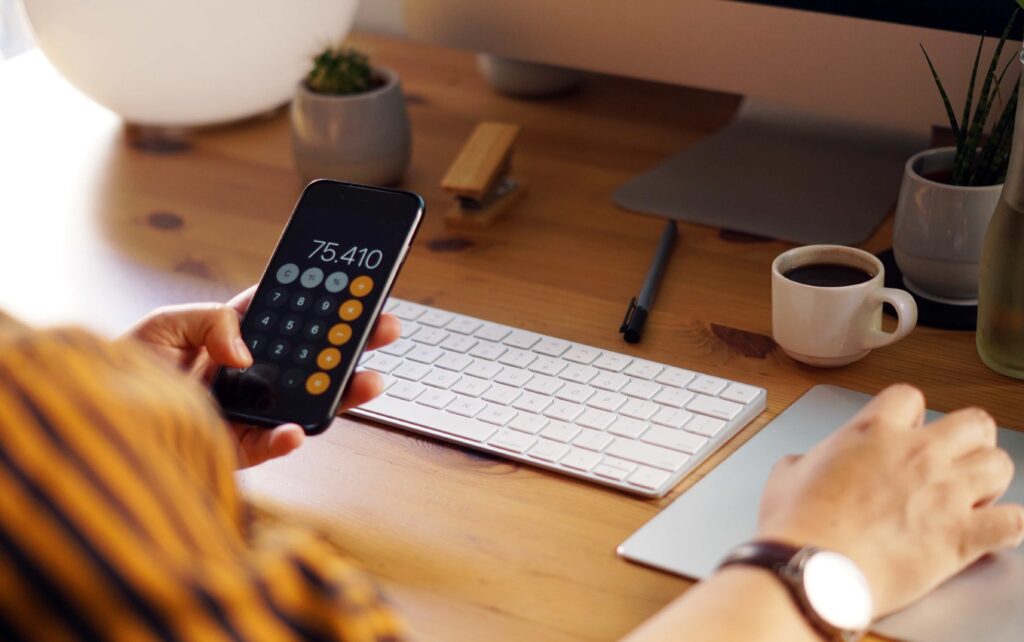 Closeup shot of an entrepreneur working from home and doing calculations