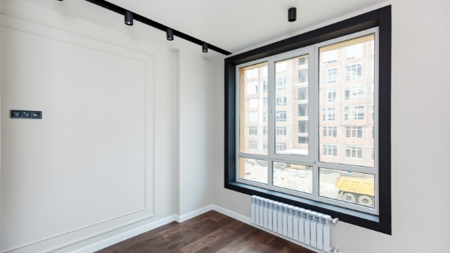 a room with a window and a radiator